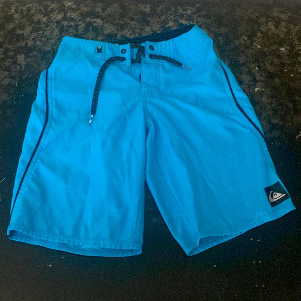 Quicksilver swim trunks in boy’s size 24 waist.
